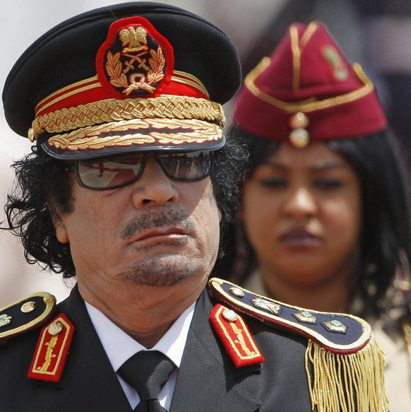 epa03728251 (FILE) A file picture dated 10 June 2009 shows former Libyan leader Muammar Gaddafi&#039;s disembarking from an airplane after its arrival in Ciampino&#039;s military airport near Rome, It ...