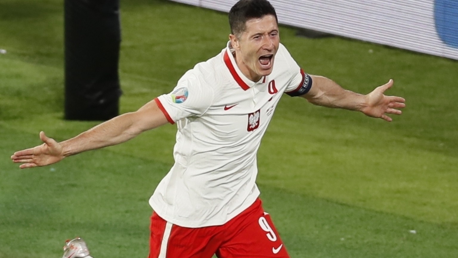 Poland&#039;s Robert Lewandowski celebrates after scoring his side&#039;s opening goal during the Euro 2020 soccer championship group E match between Spain and Poland at Estadio de la Cartuja stadium  ...