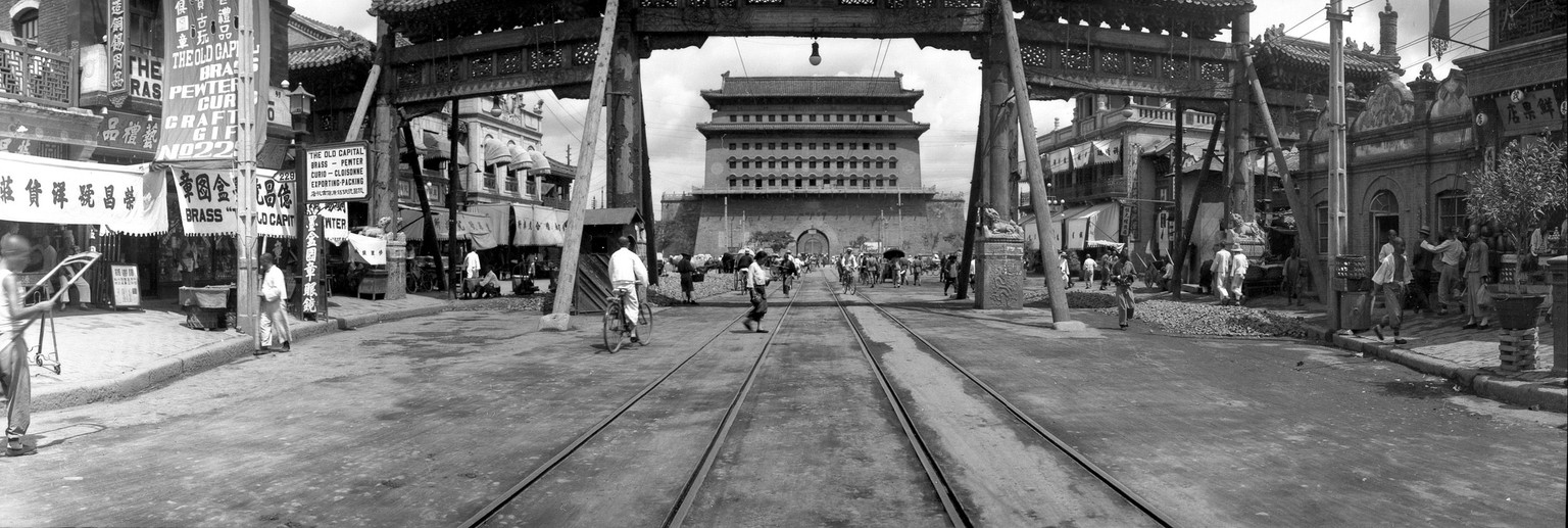 This is a general view of the Chien Men Gate, which is flanked by rows of Chinese shops in Beijing, China, on June 16, 1935. (AP Photo)