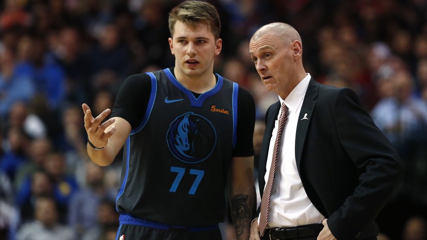 Dallas Mavericks forward Luka Doncic (77) talks with his head coach Rick Carlisle as the Mavericks play the Golden State Warriors during the second half of an NBA basketball game, Saturday, Nov. 17, 2 ...