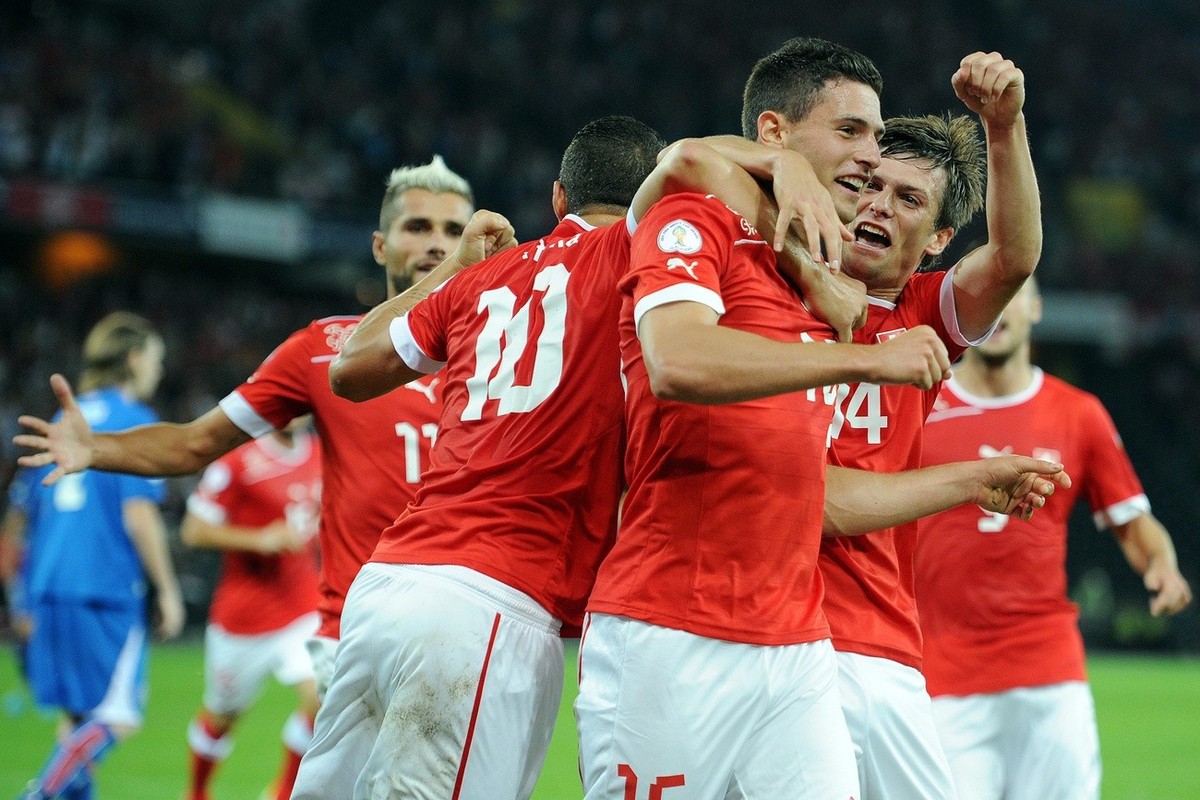 Switzerland`s Granit Xhaka, Fabian Schaer and Valentin Stocker, from left, cheer after the 2:1 goal by Fabian Schaer during the 2014 FIFA World Cup Brazil group E qualifying soccer match between Switz ...