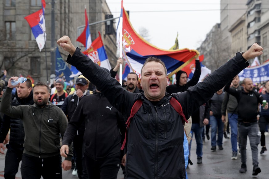epa11966397 Protesters shout the slogans and wave Serbian flags during the student-led rally in Belgrade, Serbia, 15 March 2025. University students staged a protest, demanding accountability after fi ...