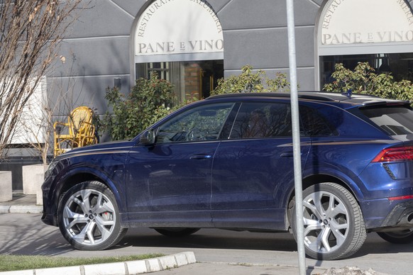 A vehicle taking Novak Djokovic, unseen, arrives at an apartment complex in Belgrade, Serbia, Monday, Jan. 17, 2022. Djokovic arrived in his native Serbia on Monday after being deported from Australia ...