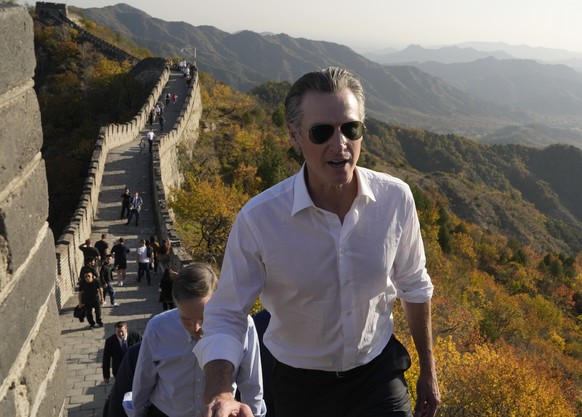 FILE - California Gov. Gavin Newsom walks up a section of the Mutianyu Great Wall on the outskirts of Beijing, on Oct. 26, 2023. Gavin Newsom&#039;s trip to China, with the stated goal of working toge ...