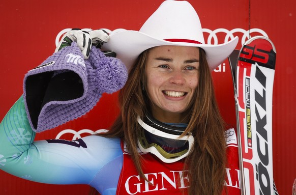 Slovenia&#039;s Tina Maze, celebrates her win on the podium following the women&#039;s World Cup downhill ski race in Lake Louise, Alberta, Friday, Dec. 5, 2014. (AP Photo/Jeff McIntosh