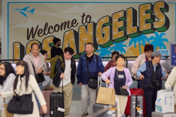 epa12161305 People arrive to the International terminal of the Los Angeles International Airport in Los Angeles, California, USA, 06 June 2025. US President Donald Trump issued a new executive order b ...