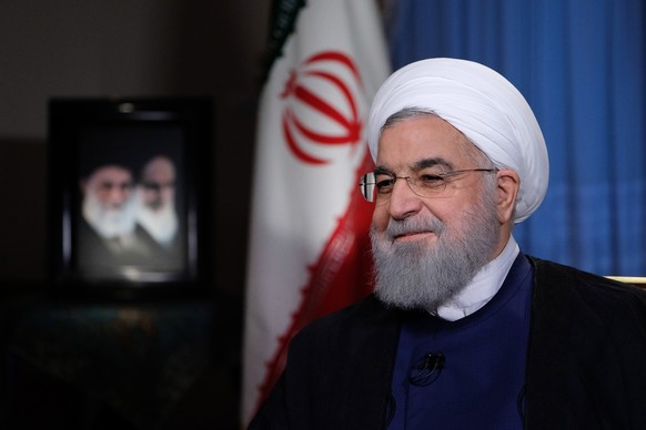 epa06931383 A handout picture made available by the presidential office shows, Iranian President Hassan Rouhani during a live TV interview in Tehran, Iran, 06 August 2018. Media reported that followin ...