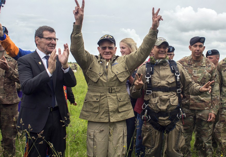 U.S. World War II D-Day veteran Tom Rice, from Coronado, CA, after parachuting in a tandem jump into a field in Carentan, Normandy, France, Wednesday, June 5, 2019. Approximately 200 parachutists part ...