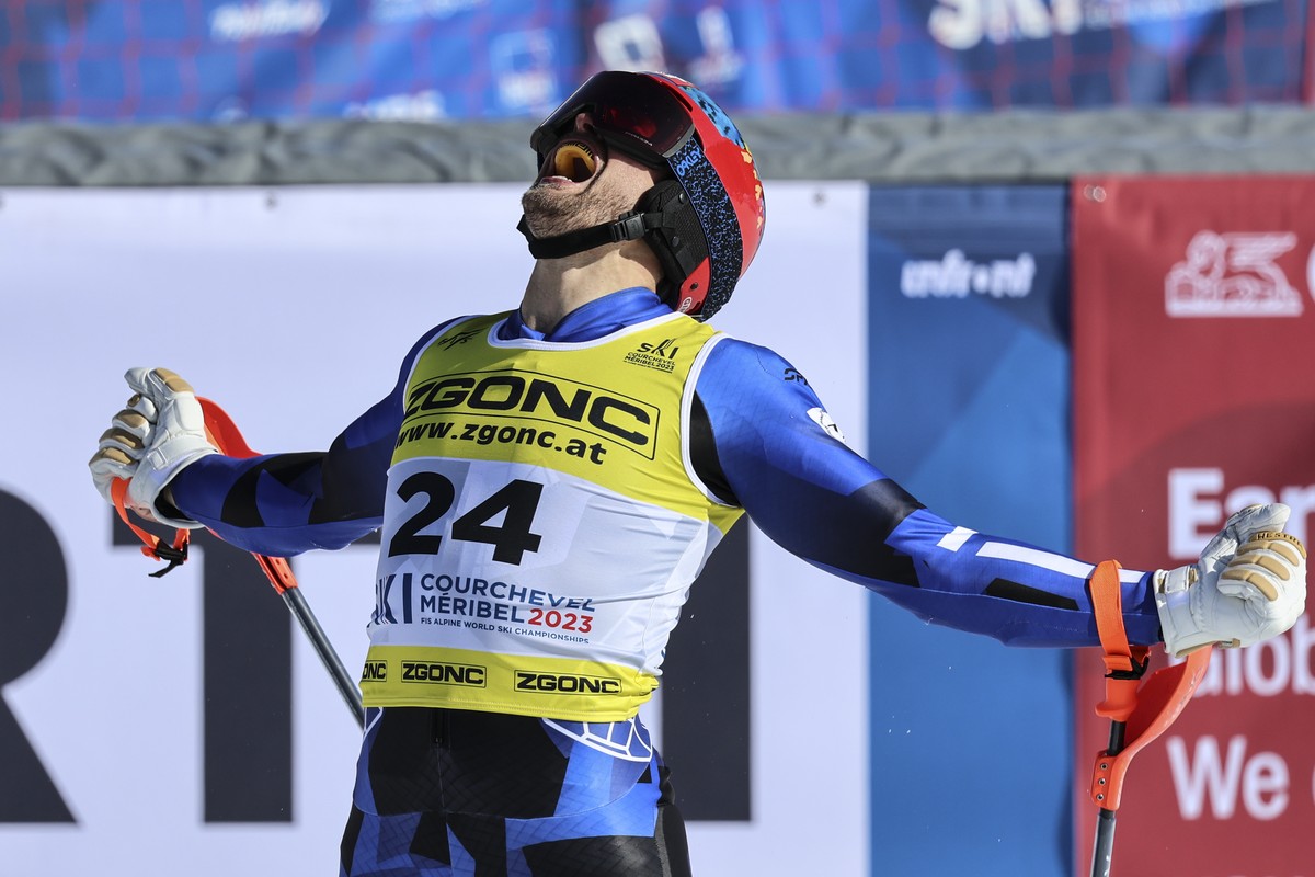 Greece's Aj Ginnis celebrates taking the silver medal in the men's World Championship slalom, in Courchevel, France, Sunday Feb. 19, 2023. (AP Photo/Marco Trovati)