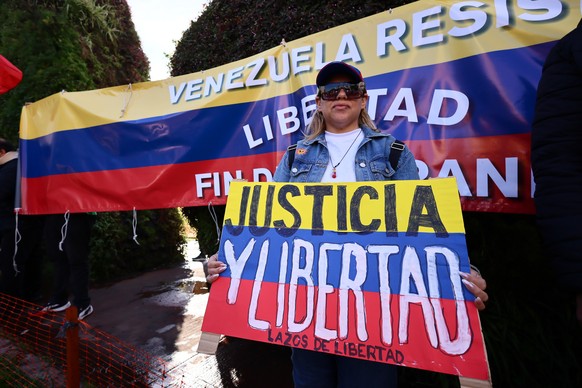 epa11523845 A woman participates in a demonstration in Buenos Aires, Argentina, 03 August 2024. Hundreds of demonstrators gathered to oppose the National Electoral Council (CNE) results of the 28 July ...