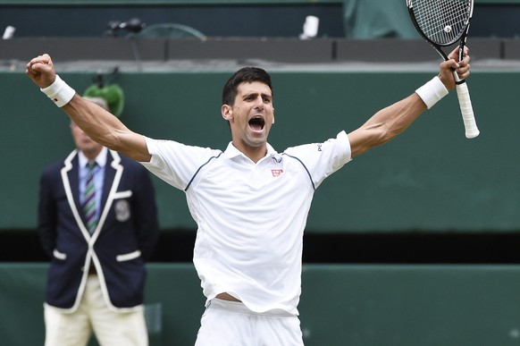 epa04844268 Novak Djokovic of Serbia celebrates his match point winner against Roger Federer of Switzerland in the men&#039;s final of the Wimbledon Championships at the All England Lawn Tennis Club,  ...