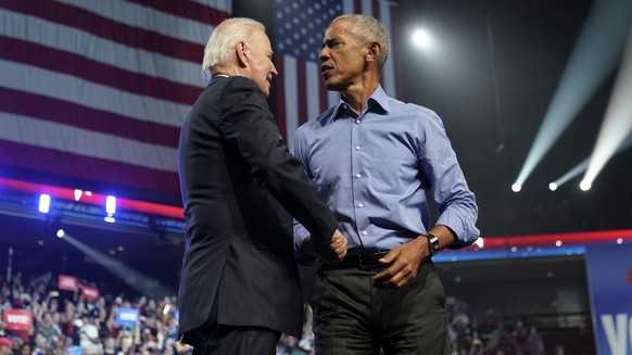 President Joe Biden and former President Barack Obama shake hands after a campaign rally for Democratic gubernatorial nominee Josh Shapiro of Pennsylvania and Democratic Senate candidate Lt.  government yes...