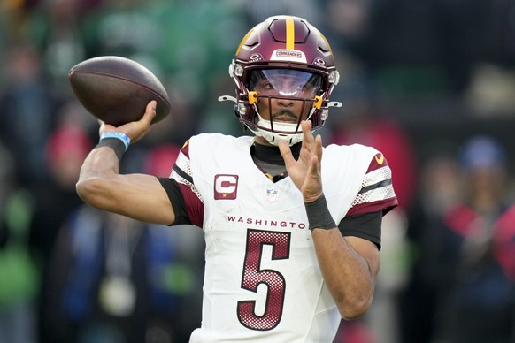 Washington Commanders quarterback Jayden Daniels passes against the Philadelphia Eagles during the first half of the NFC Championship NFL football game, Sunday, Jan. 26, 2025, in Philadelphia. (AP Pho ...