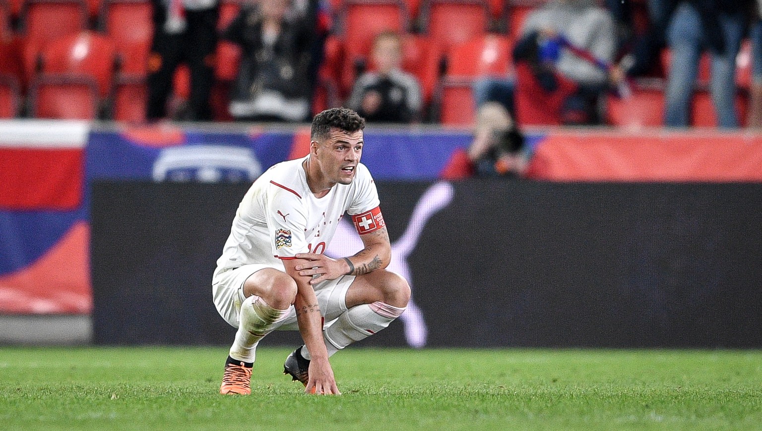 epa09992750 Granit Xhaka of Switzerland reacts after the UEFA Nations League soccer match between the Czech Republic and Switzerland in Prague, Czech Republic, 02 June 2022. EPA/LUKAS KABON