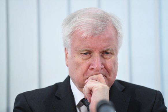 epa07910221 German Minister of Interior, Construction and Homeland Horst Seehofer attends a press conference one day after a shooting in Halle, Germany, 10 October 2019. According to the police, two p ...