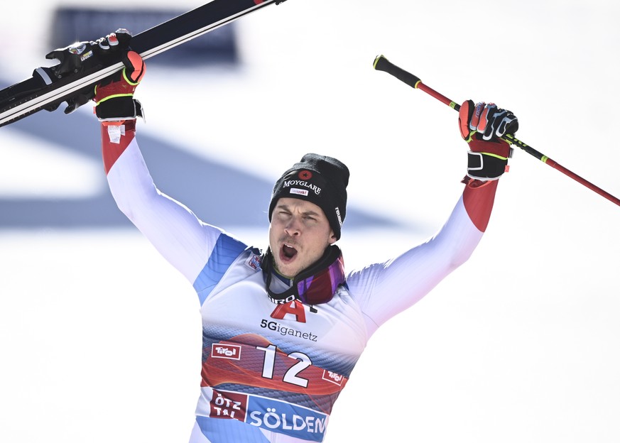 epa08755129 Third placed Gino Caviezel celebrates in the finish area after the men&#039;s Giant Slalom race of the FIS Alpine Skiing World Cup season opener in Soelden, Austria, 18 October 2020. EPA/C ...