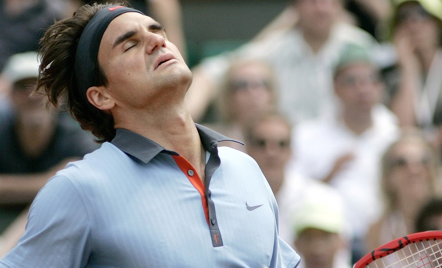 Switzerland's Roger Federer reacts after missing a point against Germany's Tommy Haas during their fourth round match of the French Open tennis tournament at the Roland Garros stadium in Paris, Monday ...