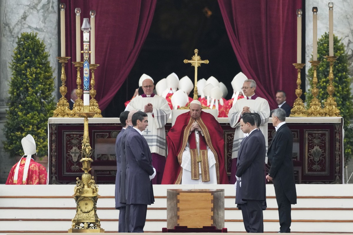 Pope Francis, centre, sits by the coffin of late Pope Emeritus Benedict XVI St. Peter's Square during a funeral mass at the Vatican, Thursday, Jan. 5, 2023. Benedict died at 95 on Dec. 31 in the  ...