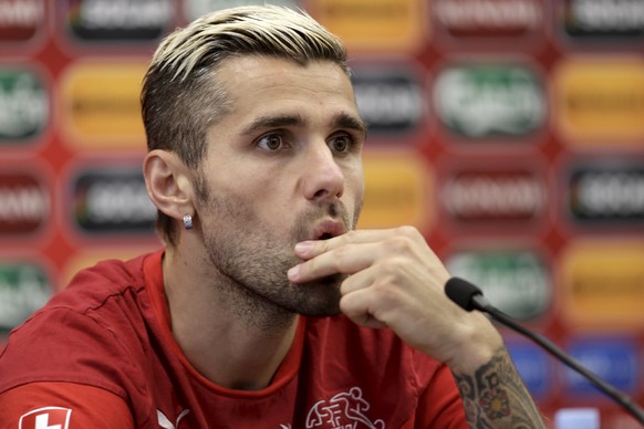 Switzerland&#039;s soccer team player Valon Behrami listens during a news conference in Vilnius, Lithuania, June 13, 2015. Switzerland will play a Euro 2016 qualification match against Lithuania in Vi ...