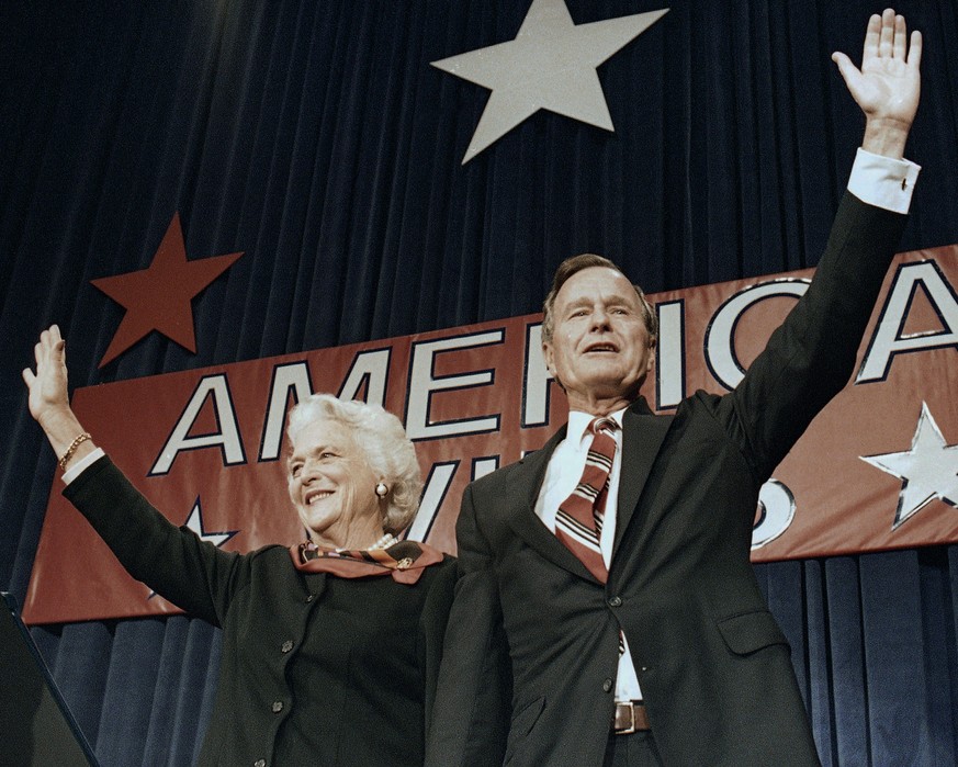 FILE - In this Nov. 8, 1988 file photo, President-elect George H.W. Bush and his wife Barbara wave to supporters in Houston, Texas after winning the presidential election. Bush has died at age 94. Fam ...