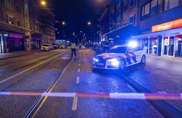 epa09218911 Emergency services in the Ferdinand Bolstraat, in Amsterdam, the Netherlands, early 22 May 2021, where five people were stabbed. A suspect has been arrested. According to Amsterdam Police  ...
