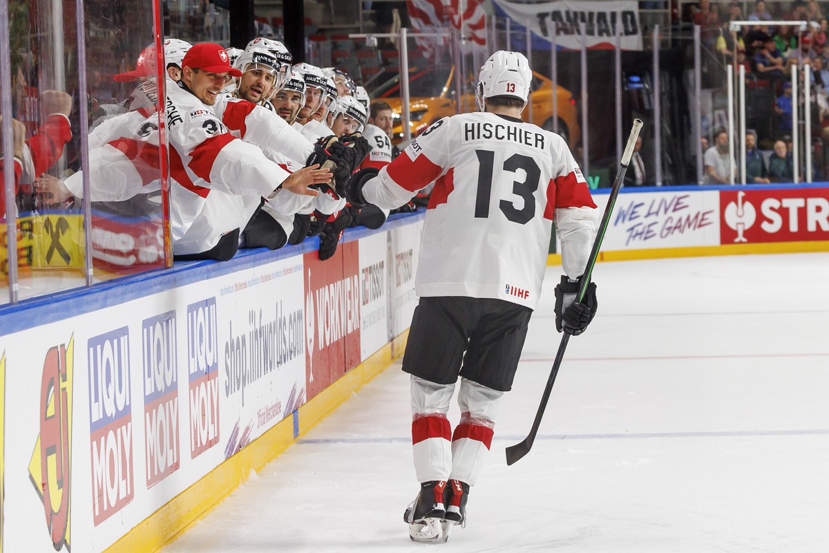 Switzerland's forward Nico Hischier #13 celebrates his goal with his teammates after scoring the 1:2, during the IIHF 2023 World Championship preliminary round group B game between Canada and Swi ...