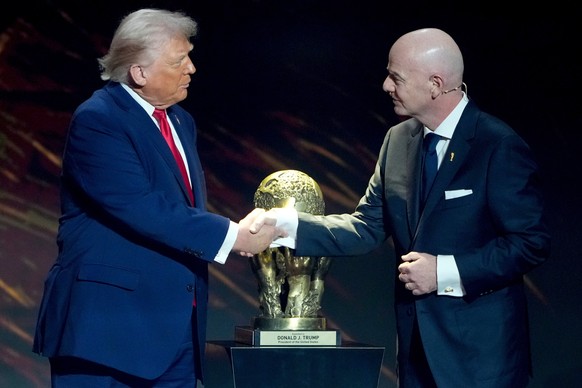 FILE - FIFA President Gianni Infantino, right, awards President Donald Trump with the FIFA Peace Prize during the draw for the 2026 soccer World Cup at the Kennedy Center in Washington, Friday, Dec. 5 ...