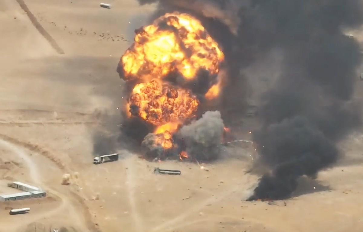 epa13220605 A handout screen grab taken from a video released on 07 September 2026 made available by the Houthi military media center shows smoke and balls of fire rising from trucks at a camp of the  ...