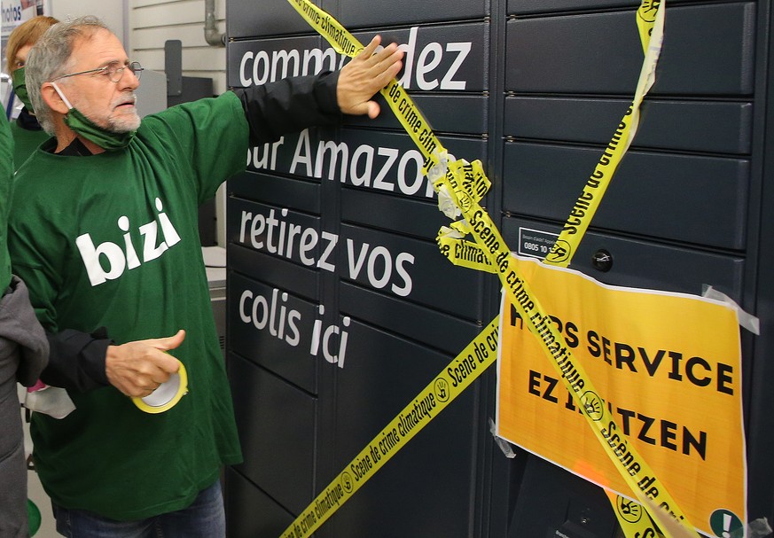 A French Basque activist from &quot;Bizi&quot; (&quot;Live&quot; in Basque) blocks an Amazon hub in Bayonne, southwestern France, Wednesday, Nov.18, 2020. The alter-globalist association Bizi protests ...