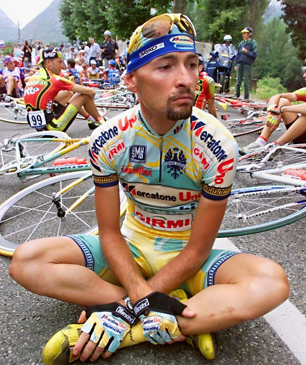 Italian Marco Pantani is seated on the road on July 24, 1998, during the Tour de France cyclists' demonstration at the beginning of the 12th stage of the French cycling race in Tarascon-sur-Arieg ...