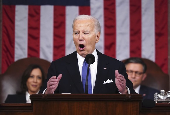 FILE - President Joe Biden delivers the State of the Union address during a joint session of Congress at the Capitol, March 7, 2024, in Washington.  Vice President Kamala Harris is on the left and...