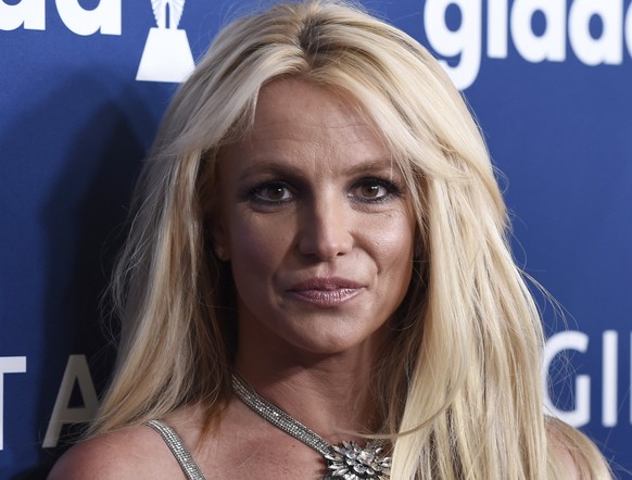 FILE - Britney Spears arrives at the 29th annual GLAAD Media Awards on April 12, 2018, in Beverly Hills, Calif. Authorities say they are investigating Spears for misdemeanor battery after a staff memb ...