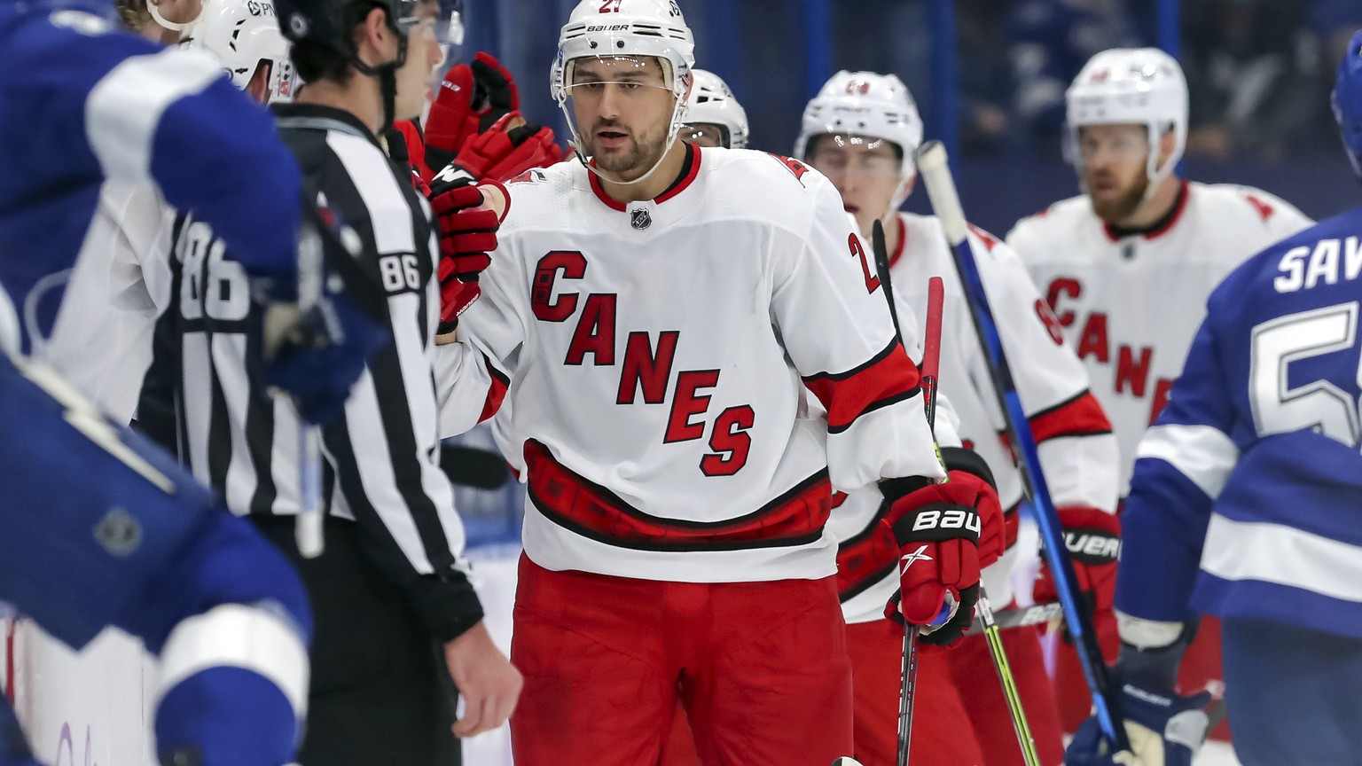 Carolina Hurricanes&#039; Nino Niederreiter (21) is congratulated for his goal against the Tampa Bay Lightning during the second period of an NHL hockey game Tuesday, April 20, 2021, in Tampa, Fla. (A ...