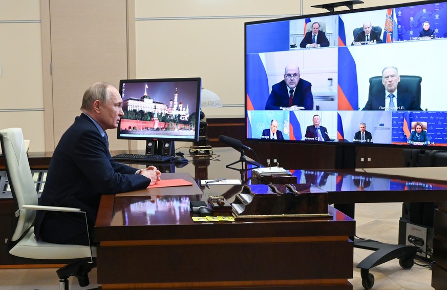 epa11249950 Russian President Vladimir Putin chairs a meeting with members of the Security Council via videoconference at the Novo-Ogaryovo state residence, outside Moscow, Russia, 29 March 2024. EPA/ ...