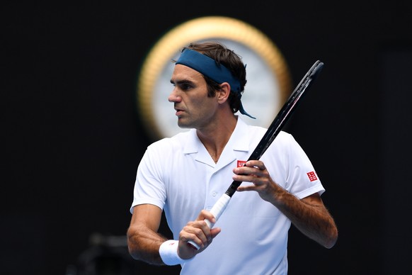 epaselect epa07288307 Roger Federer of Switzerland in action against Daniel Evans of Britain during their second round men&#039;s singles match at the Australian Open Grand Slam tennis tournament in M ...