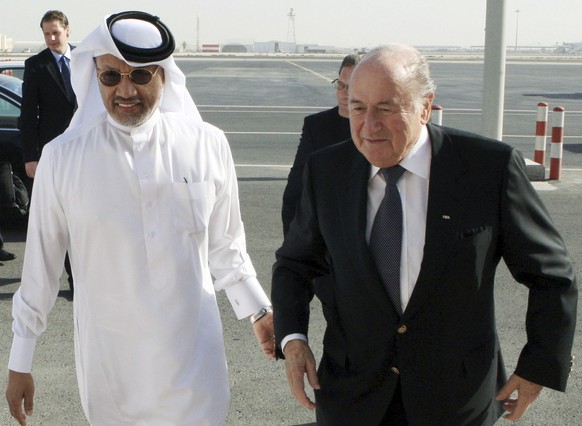 FILE - In this file photo dated Thursday Dec. 16, 2010, FIFA President Sepp Blatter, right, is welcomed by AFC president Mohammed bin Hammam upon his arrival in Doha, Qatar. FIFA has been routinely ca ...