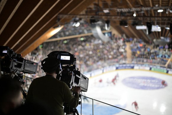 A tv camera of host broadcaster SRF captures the game during the game between Team Canada and US Collegiate Selects, at the 97th Spengler Cup ice hockey tournament in Davos, Switzerland, on Friday, De ...