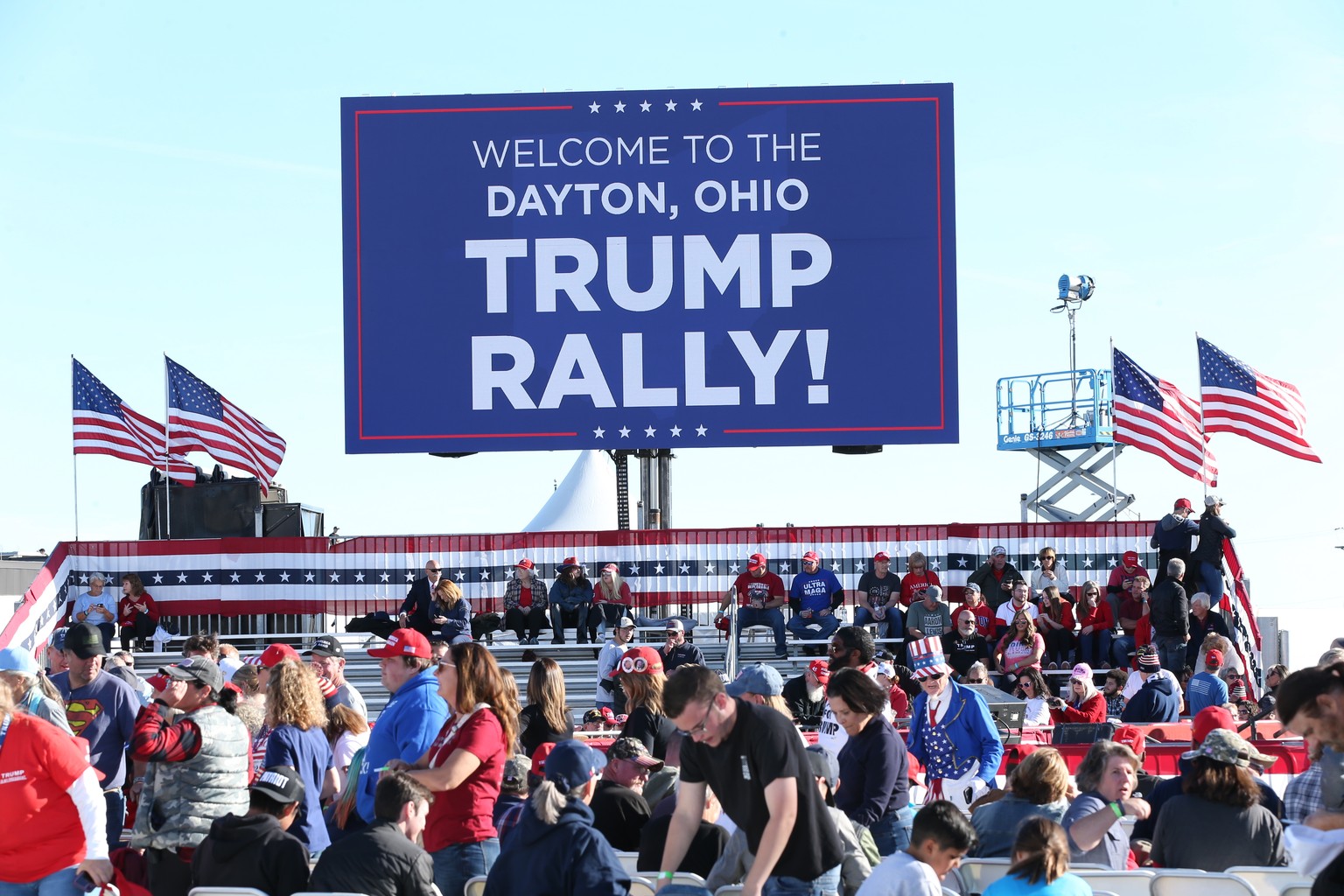 epa10292753 Supporters of former US President Donald J. Trump arrive for a rally at the Wright Bros. Aero Inc., at Dayton International Airport in Vandalia, Ohio, USA, 07 November 2020. Trump is holdi ...
