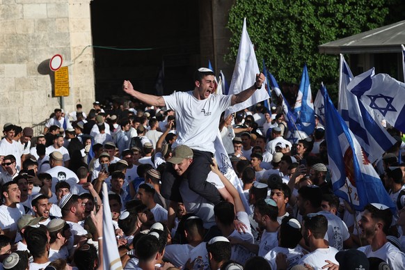 epa12957734 Right-wing Israelis gather for the annual 'Flag March' near the Damascus Gate in the Old City of Jerusalem, 14 May 2026. The march commemorated the establishment of Israeli contr ...