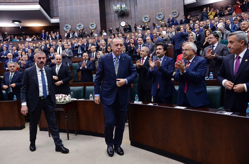 epa07112732 Turkish President Recep Tayyip Erdogan (C) prepares to address the parliament in Ankara, Turkey 23 October 2018. Erdogan is expected to address the parliament on the case of Saudi journali ...