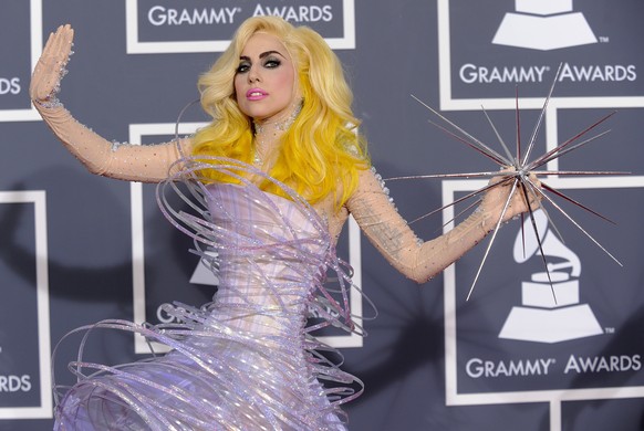 FILE - This Jan. 31, 2010 file photo shows Lady Gaga arriving at the Grammy Awards in Los Angeles wearing a futuristic lavender dress by Armani Prive. (AP Photo/Chris Pizzello, file)
Lady Gaga