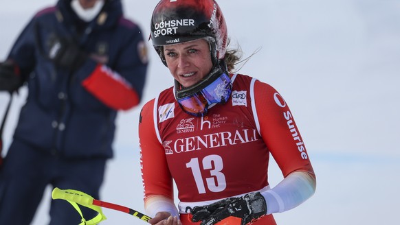 Switzerland&#039;s Corinne Suter gets to the finish area after crashing during an alpine ski, women&#039;s World Cup downhill race, in Cortina d&#039;Ampezzo, Italy, Friday, Jan. 20, 2023. (AP Photo/A ...
