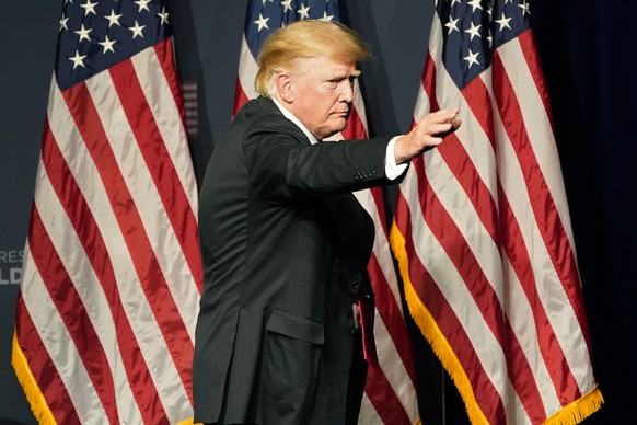 Former President Donald Trump motions after speaking at an event with Joe Lombardo, Clark County sheriff and Republican candidate for Nevada governor, and Republican Nevada Senate candidate Adam Laxal ...