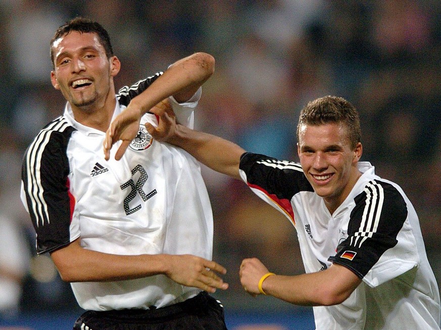 German striker Kevin Kuranyi (left) celebrates with teammate Lukas Podolski after Podolski scored a 3-1 lead in the international friendly match between Thailand and Germany at Rajamangala National Stadium.