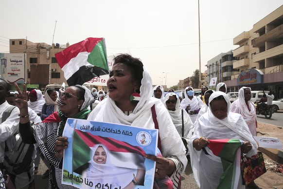 Women chant slogans protesting violence used against protesters using bullets and internationally banned weapons in the twin city of Omdurman, about 18 miles (30 km) northwest of the capital Khartoum, ...