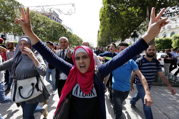 epa05982080 Tunisian protesters shout slogans during a demonstration to support unemployed Tunisians after a person was killed on clashes between security forces and protesters, in Tataouine, South of ...