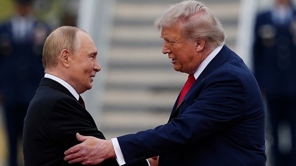 FILE - U.S. President Donald Trump greets Russian President Vladimir Putin, Aug. 15, 2025, at Joint Base Elmendorf-Richardson, Alaska. (AP Photo/Julia Demaree Nikhinson, File)
Vladimir Putin,Donald Tr ...