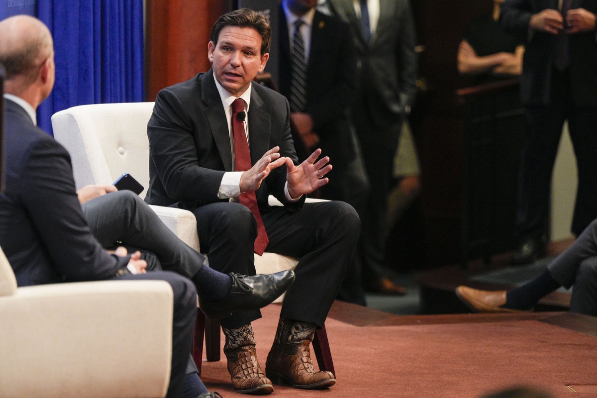 Republican presidential candidate Florida Gov. Ron DeSantis speaks with Epoch Times Senior Editor Jan Jekielek and Heritage President Kevin Roberts, left, at the Heritage Foundation, Friday, Oct. 27,  ...