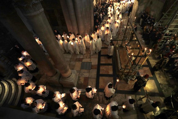 epa07513516 Christian worshippers take part in the procession of the holy Thursday, during the Catholic Washing of the Feet ceremony on Easter Holy Week, at the Church of the Holy Sepulcher in Jerusal ...