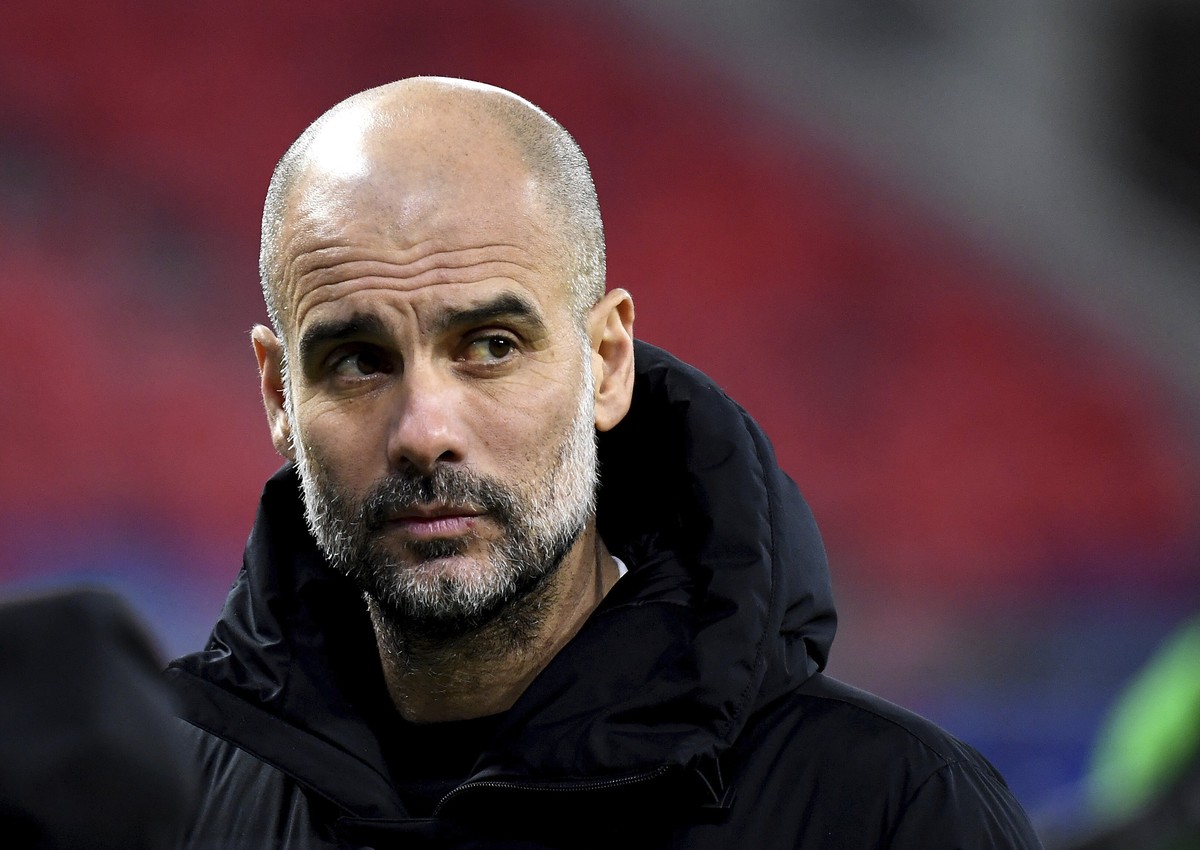 Manchester City's head coach Pep Guardiola reacts after a Champions League round of 16 second leg soccer match between Manchester City and Borussia Moenchengladbach at the Puskas Arena in Budapes ...